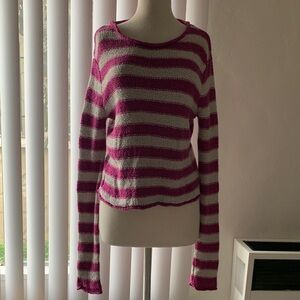 Free people sweater 84% cotton 16% rayon.